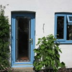 Blue window and door frames in Bedford property