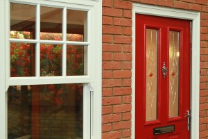 Red composite door in a double glazing showroom in Northampton- good front door