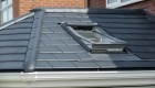Grey slate tiled roof conservatory with roof window