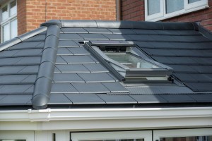 Grey slate tiled roof conservatory with roof window