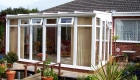 White PVCu Lean To Conservatory bungalow installation